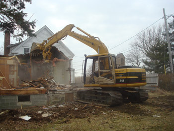 Dalpe Excavation demolishing a house in Falmouth Cape Cod